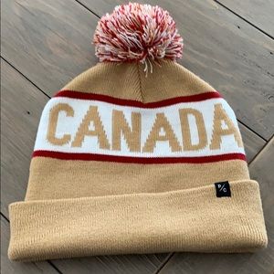 Home is Canada winter hat by peace collective